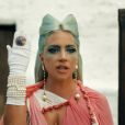  O momento difícil pelo qual Lady Gaga estava passando quando escreveu o "Chromatica" transparece em algumas canções do álbum, como em "911", em que ela fala sobre ser sua maior inimiga 