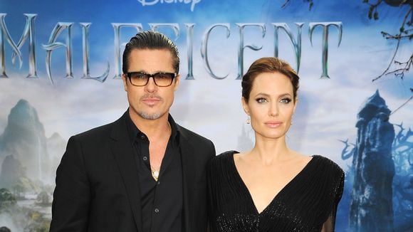 Com look inspirado em "Malévola", Angelina Jolie divulga filme com Brad Pitt