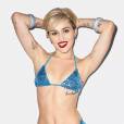  Miley Cyrus mostra tatuagens em foto de biqu&iacute;ni 