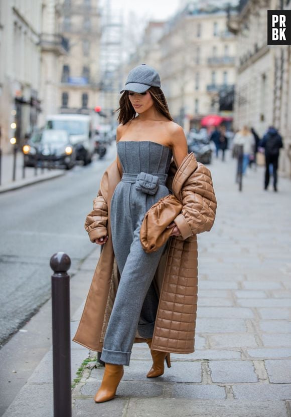 Olivia Culpo combina look elegante com boné e casaco puffer longo