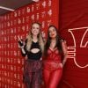 Rock in Rio: Tatá e Bruna, do PodDelas, foram com vermelho em destaque